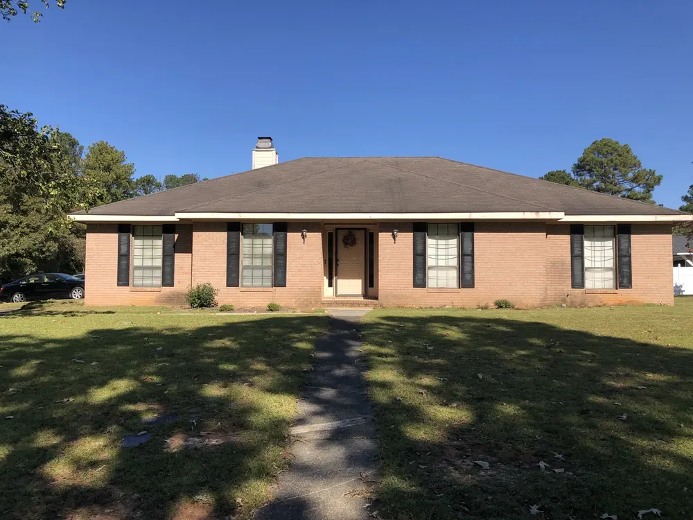 A Middle Georgia brick ranch that needs a roof and updates, bought as-is for cash